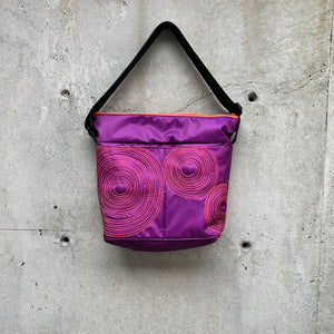 large zippered bag with outer pockets: plum with orange