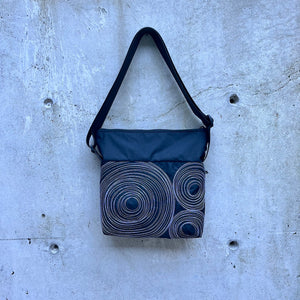 small zippered bag: black with white stitching