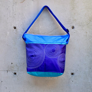 large zippered bag with outer pockets: purple/teal/blue (22-27)