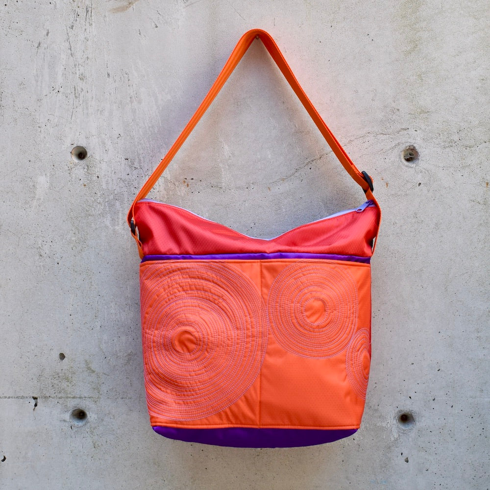 large zippered bag with outer pockets: orange/purple/red (22-13)
