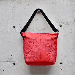 large zippered bag with outer pockets: red with mauve