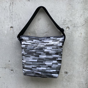 large zippered bag: grey collage